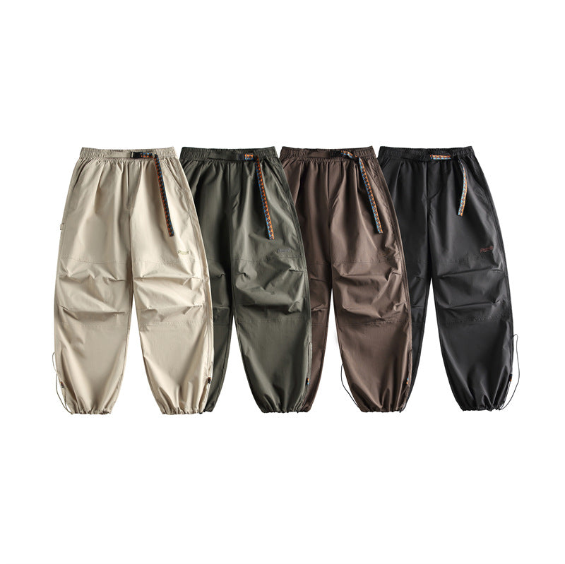 Solid color minimalist waistband casual pants for men with drawstring leg ties